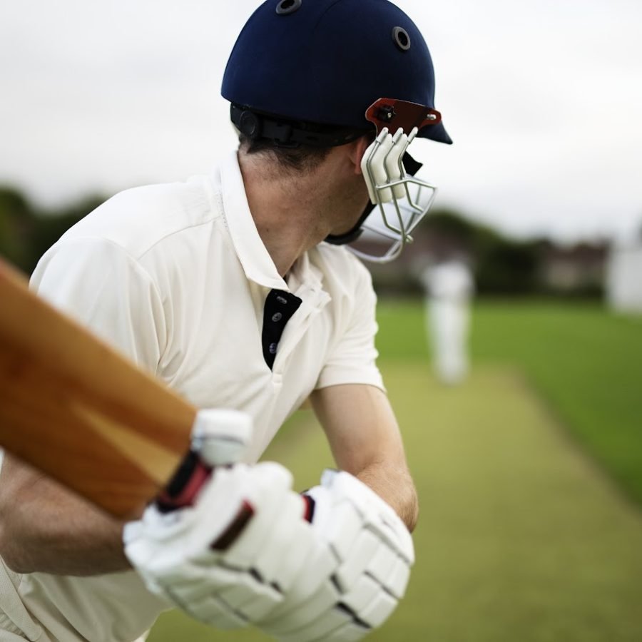 Cricketer on the field in action